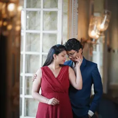 An intimate portrait using the soft window light in a heritage building. The warm lighting and elegant setting create a timeless and romantic mood.