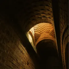 Another angle of the brick dome at the Samyak Yoga Retreat, showing the depth and complexity of the structure. The vault creates a powerful, enclosing space perfect for meditation.