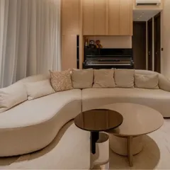 A different angle of the Poet Sofa, highlighting its graceful curves and how it defines a space. Crafted with a solid Alder wood frame and customizable upholstery, it’s a perfect example of our commitment to creating furniture that is both a statement piece and a haven of comfort.