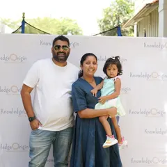 A family poses together at a school event, highlighting the importance we place on family involvement.