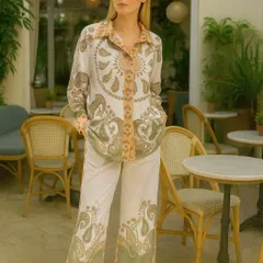 Embrace a bohemian vibe with this paisley print co-ord set. The intricate green and beige paisley pattern gives this outfit a sophisticated yet relaxed feel. It's a complete look with a matching long-sleeved shirt and wide-leg pants, perfect for a stylish day out.