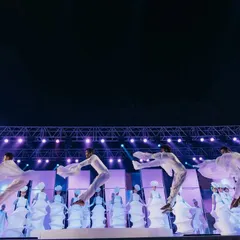 Another shot of the incredible dance performance, with the dancers in white creating beautiful shapes on stage.