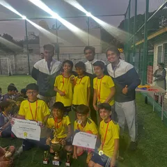 The Under-10 winners of the Samurai Cup with their coaches. A fantastic achievement that showcases their skill and teamwork.