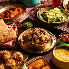 A grand feast of classic Indian dishes from Gallops. This bountiful spread, featuring everything from curries to biryani and kebabs, showcases the restaurant's expertise in traditional fine dining.