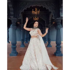 Rent this elegant lehenga for your next big event. Its light color and classic design make it a versatile choice that can be styled in many different ways.