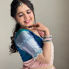My client Payal looking absolutely lovely for a traditional event. Her makeup features soft, shimmery eyes and a pink lip that brings out her youthful glow.