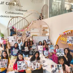 A group of amazing women holding up their vision boards after our workshop. We believe healthcare is the foundation for your goals, and that women united are stronger than solo struggles.