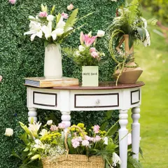 In the little details, we find the essence of a magic-filled celebration. This charming console table with fresh flowers and books created a lovely, welcoming vignette at a brunch event.