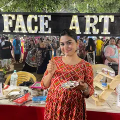 One of our artists at our stall during a Heritage Garba event, ready to create some festive looks.