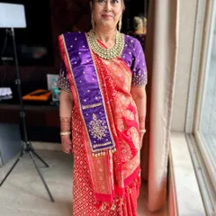 Flawless beauty at every age. This full portrait shows the soft-focus makeup and elegant saree, creating a perfect regal touch for the mother of the groom.