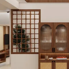 A closer look at Bhuvana's crockery unit, showing the beautiful detail of the fluted glass and the wooden partition that adds a touch of traditional charm.