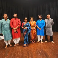 A group photograph with my disciple and the talented musicians. Supporting my students as they take the stage is one of the most fulfilling aspects of being a guru.