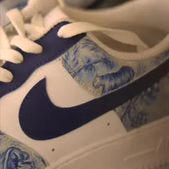 This is my take on a hypothetical Dior and Nike collaboration. I hand-painted the iconic Dior Toile de Jouy animal print in a beautiful blue onto the panels of these classic white Air Force 1s.