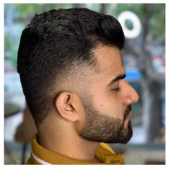 Another example of our flawless fade technique. The hair is blended perfectly from the skin up, creating a modern and stylish look.