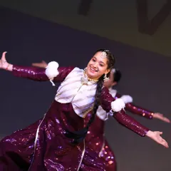 The joy on a performer's face says it all. This shot captures the grace and happiness of a traditional Bhangra performance, a style I love teaching for its infectious energy.