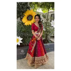 Prathima posing next to a giant sunflower at her haldi ceremony. Her happy, vibrant look perfectly matches the fun and colorful theme of the event.