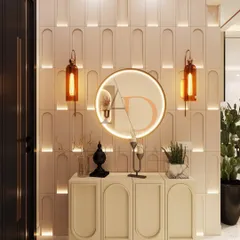 A frontal view of the entryway console, with its arched shutters, ribbed skirting, and a backlit round mirror flanked by amber pendant lights.