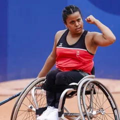 This is Nalani Buob, a world-ranked wheelchair tennis player, inspiring our athletes at a high-performance camp. We believe the court knows no boundaries, and her story proves that limitations only exist in the mind.
