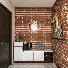 This entryway design features a practical shoe rack with a built-in seating bench. The exposed brick wall and geometric pendant lights add a touch of industrial chic to the functional space.