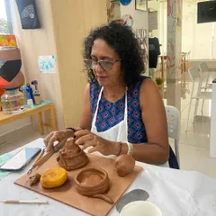 A participant carefully crafting miniature items from clay. My workshops guide you through creating both functional and decorative pieces.