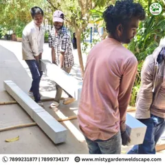 Teamwork is essential when handling these large stone pillars. We ensure every piece is moved and placed with care and precision.