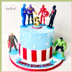 Avengers assemble on this heroic two-tiered cake for a 5th birthday. It features a full cast of favorite heroes like Captain America, Thor, and Hulk, set against a patriotic red, white, and blue design.