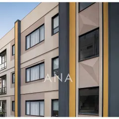 A detailed view of the Yellow Line Apartment's facade, showing the geometric patterns and the vertical yellow band. This was a solution to add visual interest and break the monotony of a flat surface on a narrow plot.