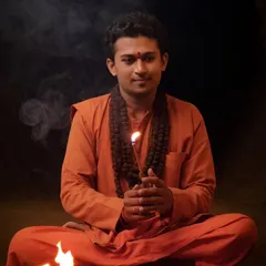 Holding a flame, a symbol of inner light and truth. My journey as a yogi is about cultivating this flame within myself and helping others find theirs.