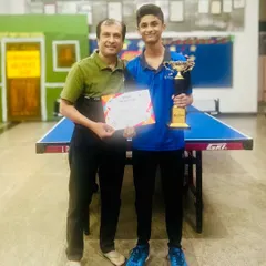 We guide players to the pinnacle of success. This is one of our champions with his well-deserved trophy, a testament to the hard work and advanced strategy we instill in our competitive program.