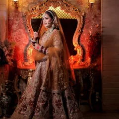 This full-length portrait showcases the grandeur of a bridal lehenga against a regal, warmly lit backdrop. My goal is to create not just a photo, but a majestic scene that tells a story of elegance.