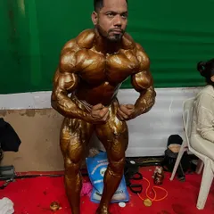 A most muscular pose backstage. This pose is all about showing maximum muscle density and hardness.
