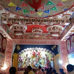 The interior of the Jalpaiguri Muhuri Para Durga Puja pandal, showing the beautifully decorated ceiling with a traditional Assamese 'Japi' design.