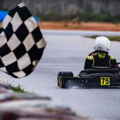 The moment every driver dreams of: crossing the finish line to the checkered flag. This shot from the Meco Meritus Cup captures the culmination of a weekend of intense racing, strategy, and pure determination.