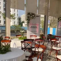 A closer look at the event branding, with custom banners and floral accents that seamlessly integrate the company's identity into the decor.