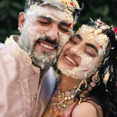 A close-up of a couple's joyful, messy faces after their Haldi. This is the kind of authentic, happy memory I love to preserve.