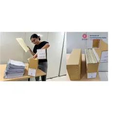 An archivist carefully placing documents into acid-free folders and boxes. This process of physical preservation is essential to prevent the deterioration of paper records, ensuring they survive for future generations of scholars.