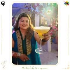 A happy bride holding her personalized cocktail. The custom monogram adds a special touch that is both elegant and perfect for photos.