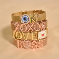 Say it all without saying a word. This stack of personalized mesh bracelets shows off some of my favourite words to wear: 'BOSS', 'LOVE', 'XOXO'. What will yours say?