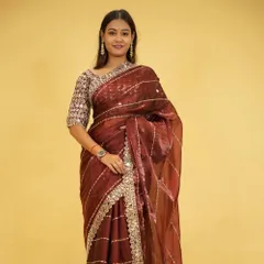 A stunning example of a party-wear 1-minute saree. This piece features delicate mirror work along the border and a rich, sheer fabric that is pre-stitched for a flawless drape every time.