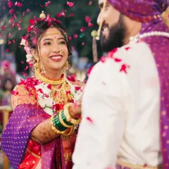 The bride's beautiful smile during the Varmala ceremony, a key moment in a Maharashtrian wedding.