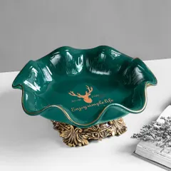 This elegant green ceramic serving bowl features a vintage-style ornate base. The "Enjoy simple life" inscription adds a charming touch, making it perfect for serving fruits or salads.