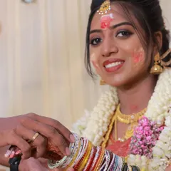 A candid moment from Aarthi's baby shower ceremony. Even with the traditional nalangu rituals, her makeup stayed put and looked fresh and vibrant.