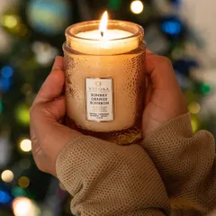 Uplift your holiday spirit with the scent of Bombay Orange Bourbon. This fragrance, a blend of orange, bourbon, mango, and clove, is a wonderfully warm and festive choice for the season.