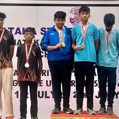 Our youth men's team proudly displays their silver medals for the 10m Air Rifle ISSF event at the Karnataka State Shooting Championship. Team events build camaraderie and competitive spirit.