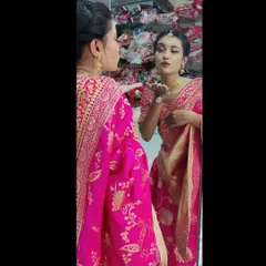 A candid moment showing how confident and beautiful my client felt. The makeup is designed to look stunning from every angle, complementing her traditional attire and gold jewelry perfectly.