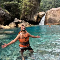 Taking a dip in the crystal clear waters of Blue Lagoon in Meghalaya. I know the best spots for a refreshing swim, away from the crowds.