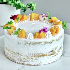 For all the mango lovers, this one is pure sunshine. My Fresh Mango Naked Cake features a fluffy vanilla sponge, layered with juicy, seasonal mangoes and my signature light diplomat cream. It’s a seasonal special you won't want to miss.