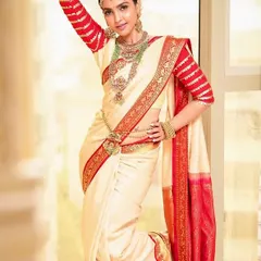 This full-length shot showcases the complete South Indian bridal attire. I provide hair styling and makeup that perfectly matches the grandeur of the outfit.