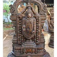Our 79-inch standing Lord Venkatajalapathy sculpture is carved with immense devotion and detail. Finished in a classic wax brown, this statue showcases the intricate ornamentation and serene divinity characteristic of South Indian temple art.