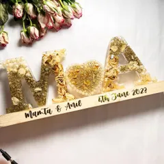 This is currently my favorite preservation style. The couple's initials and a heart, all filled with their wedding flowers and set on a wooden lamp base with their names and wedding date.